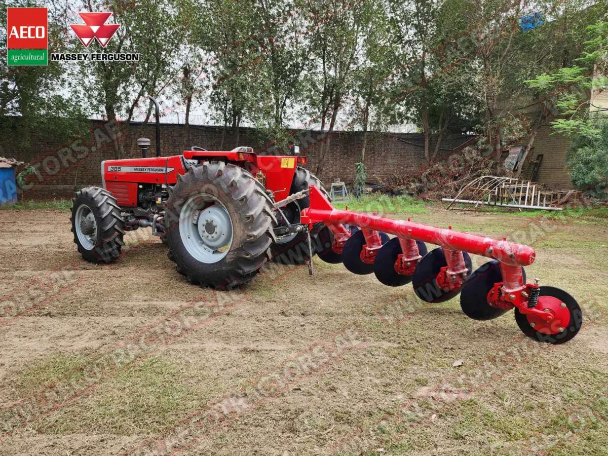 High-quality image of 5 disc plough with tractor.