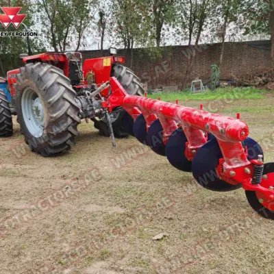 Rear view of tractor with attached 5 disc plough.